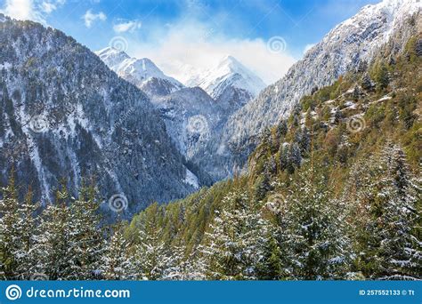 View At Mountain Ravine With Snow Capped Mountain Peaks Stock Image