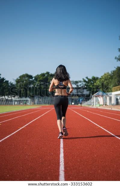 Athletic Woman Running On Track Stock Photo 333153602 Shutterstock