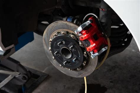 Premium Photo Checking Car Brake System For Repair At Car Garage