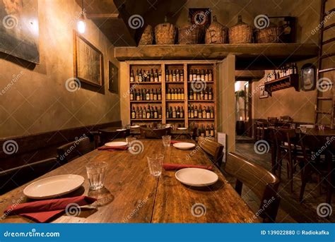 Evening In Bar With Wooden Tables Wine Cellar And Retro Decoration Of