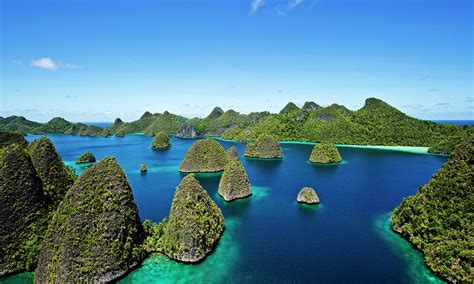 Aerial View Of Wayag Islands With Blue by James Morgan