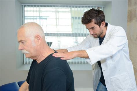 Physiotherapist Doing Back Massage To Patient In Medical Office Stock Image Image Of Adult