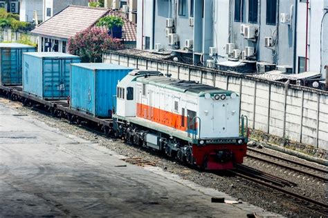 Premium Photo Freight Train Locomotive Carrying With Cargo With Blue