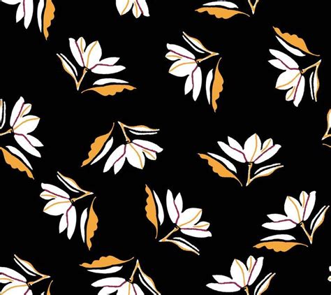 A Black Background With White And Orange Leaves