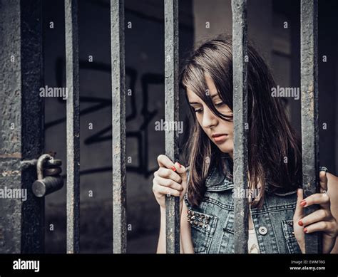 Young woman who is imprisoned Stock Photo - Alamy