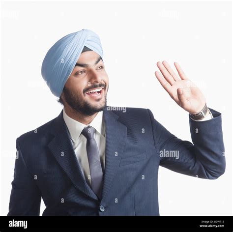 Businessman waving his hand Stock Photo - Alamy