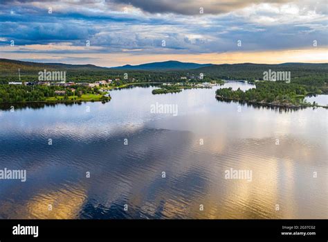 Clouds reflecting at sunset on Lake Inari, Inari, Lapland, northern Finland Stock Photo - Alamy