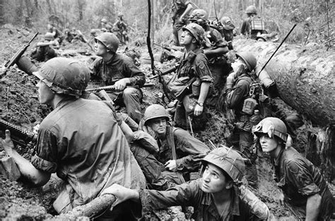 Description Of American Infantrymen Crowd Into A Mud Filled Bomb Crater