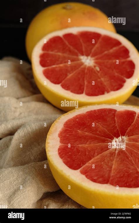 Sliced Ripe Grapefruit On A Light Cloth Stock Photo Alamy