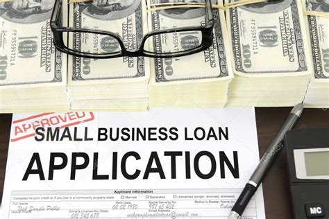 Approved small business loan application form and money — Stock Photo © mangostock #21501219