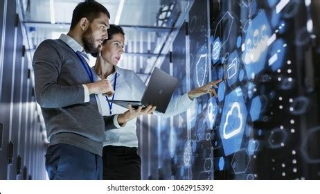 Male Specialist Holds Laptop Discusses Work Stock Photo 1062915392 ...