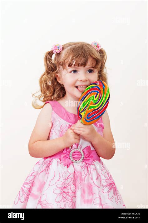 Little girl lollipop hi-res stock photography and images - Alamy