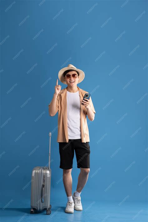 Premium Photo | Portrait of Asian man posing on blue background ...