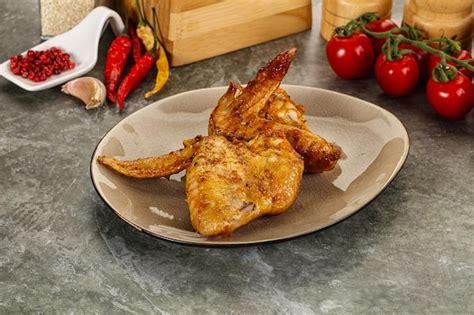 Premium Photo Tasty Roasted Chicken Wing With Spices And Herbs