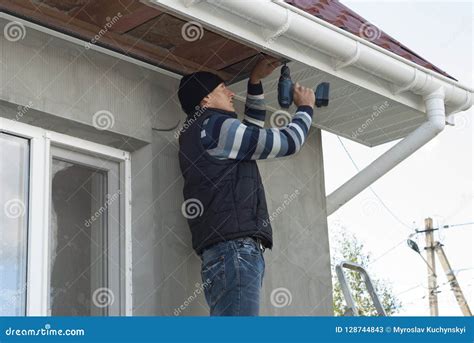 Installation of soffits stock image. Image of architecture - 128744843