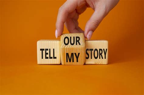 Tell Our Or My Story Symbol Businessman Hand Turns Wooden Cubes And