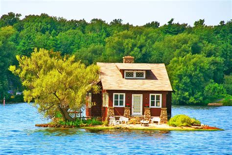 A Small House Sitting On An Island In The Middle Of A Lake Surrounded