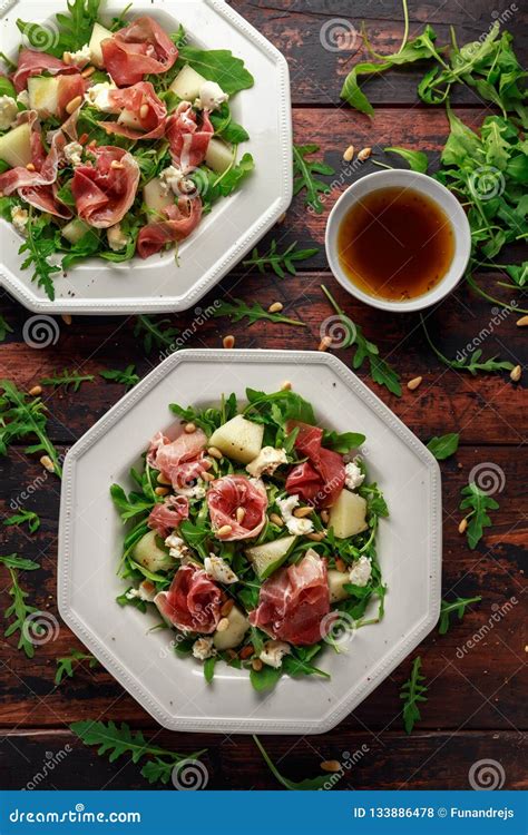 Parma Ham And Melon Salad With Mozzarella Rocket And Pine Nuts Stock