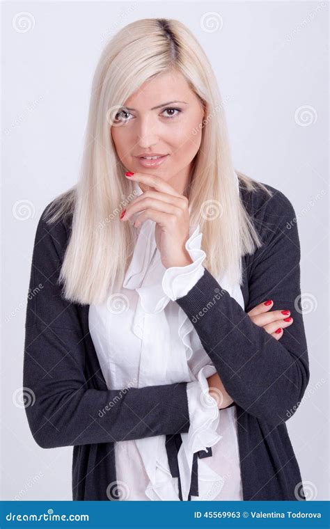 Portrait Of Casual Dressed Blond Woman Posing With Arms Crossed Stock