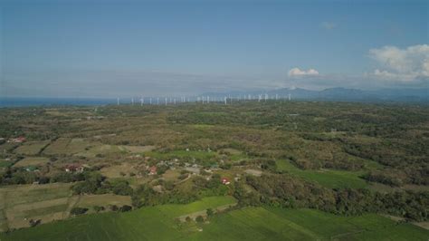 Premium Photo Solar Farm With Windmills Philippines Luzon