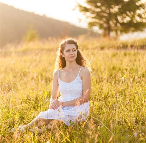 Woman Sitting On The Field View Landscape Stock Photo Image Of