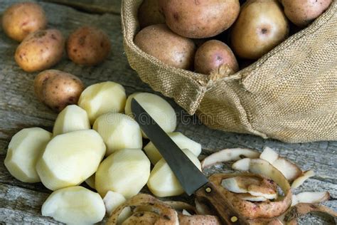 Peeled Potatoes Kitchen Knife Potato Peels And A Burlap Sack Of