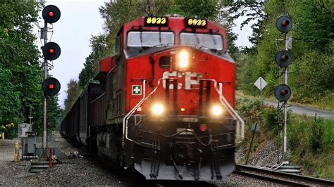 Two Cpkc Freight Trains Race Down The Double Track With Kcs And Cn