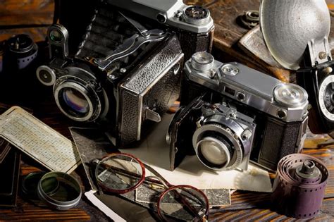 Premium Photo | A collection of old cameras and other items including a camera.