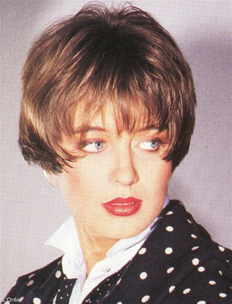 Short Eighties Hairstyle With The Hair Cut Very Short At The Back