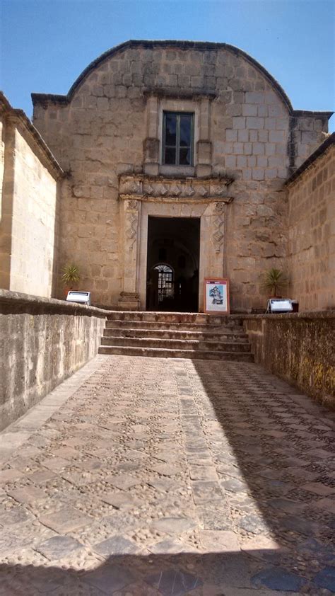 An Old Stone Building With Steps Leading Up To It