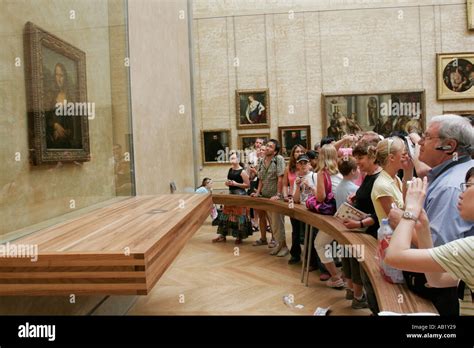 People looking at the Mona Lisa in Louvre Museum Paris France Stock Photo - Alamy