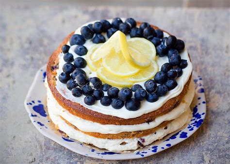 Lemon Blueberry Naked Cake With Blueberries On The Top And Mascarpone Butter Frosting Stock