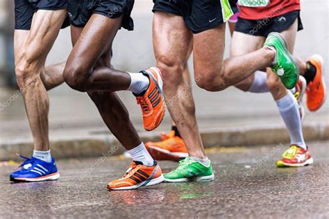 Group of runners with colorful shoes and muscular legs at ASICS – Stock ...