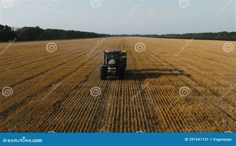 Aerial View Of Farmer Fertilizing Agricultural Field Spreading Mineral