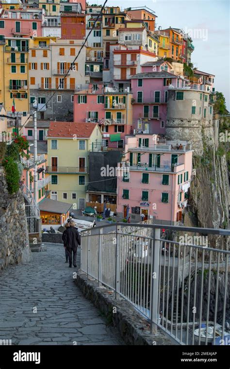 People Walking Towards Colorful Cliffside Houses Of Manarola One The 5