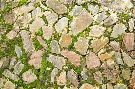 Old stone wall covered with moss Stock Photo by ©bentaboe 89136486