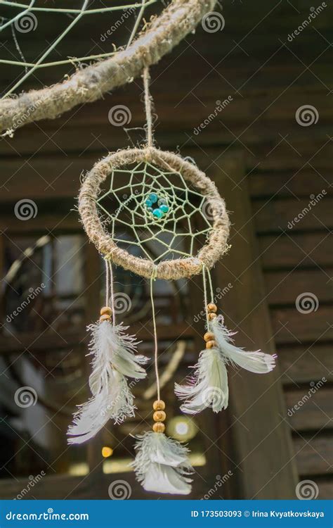 Close Up of a Dream Catcher with Feathers Hanging Outdoors Stock Image ...