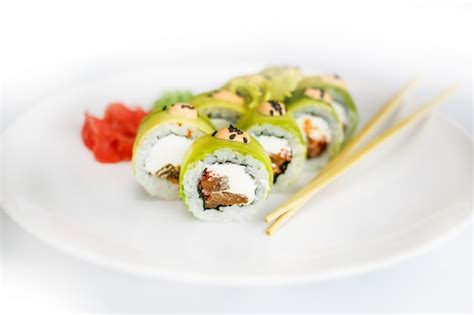 Premium Photo Japanese Seafood Sushi Roll And Chopstick On A White