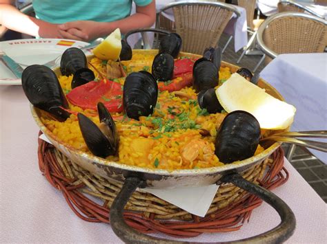 This Spanish Seafood Paella Features A Crusty Saffron And Veggie Infused Layer Of Rice Topped