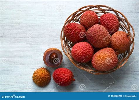 Fresh Organic Lychees In A Basket On A Light Blue Wooden Background