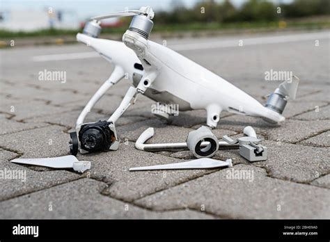 Crashed modern drone and camera after drone accident Stock Photo - Alamy