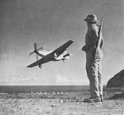 “a Damaged 45th Fighter Squadron 15th Fighter Group P 51 Mustang Lands At Iwo Jima Airbase As