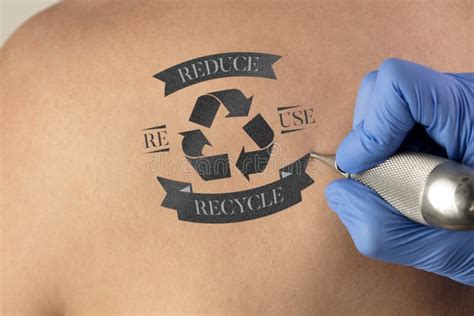 Tattooing Recycle For A Better Environment Concept On Naked Back Stock