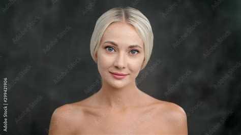 Beautiful Naked Female Model Smiling Posing Isolated At Black Studio