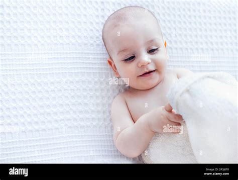 Little Cute Child Wearing Hooded Towel After Bath Or Shower Smiling