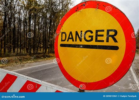 Warning Road Sign on Road in Red Circle on Yellow Color. Danger Ahead ...