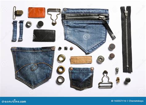 Composition With Garment Accessories And Cutting Details For Jeans