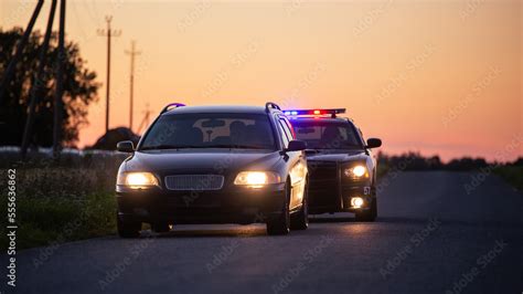 speeding driver  pulled   police patrolling car wide shot