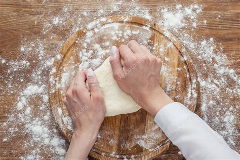 Hands kneading dough — Stock Photo © IgorVetushko #159133176