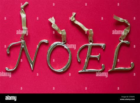 Hanging brass letters spelling noel hi-res stock photography and images - Alamy